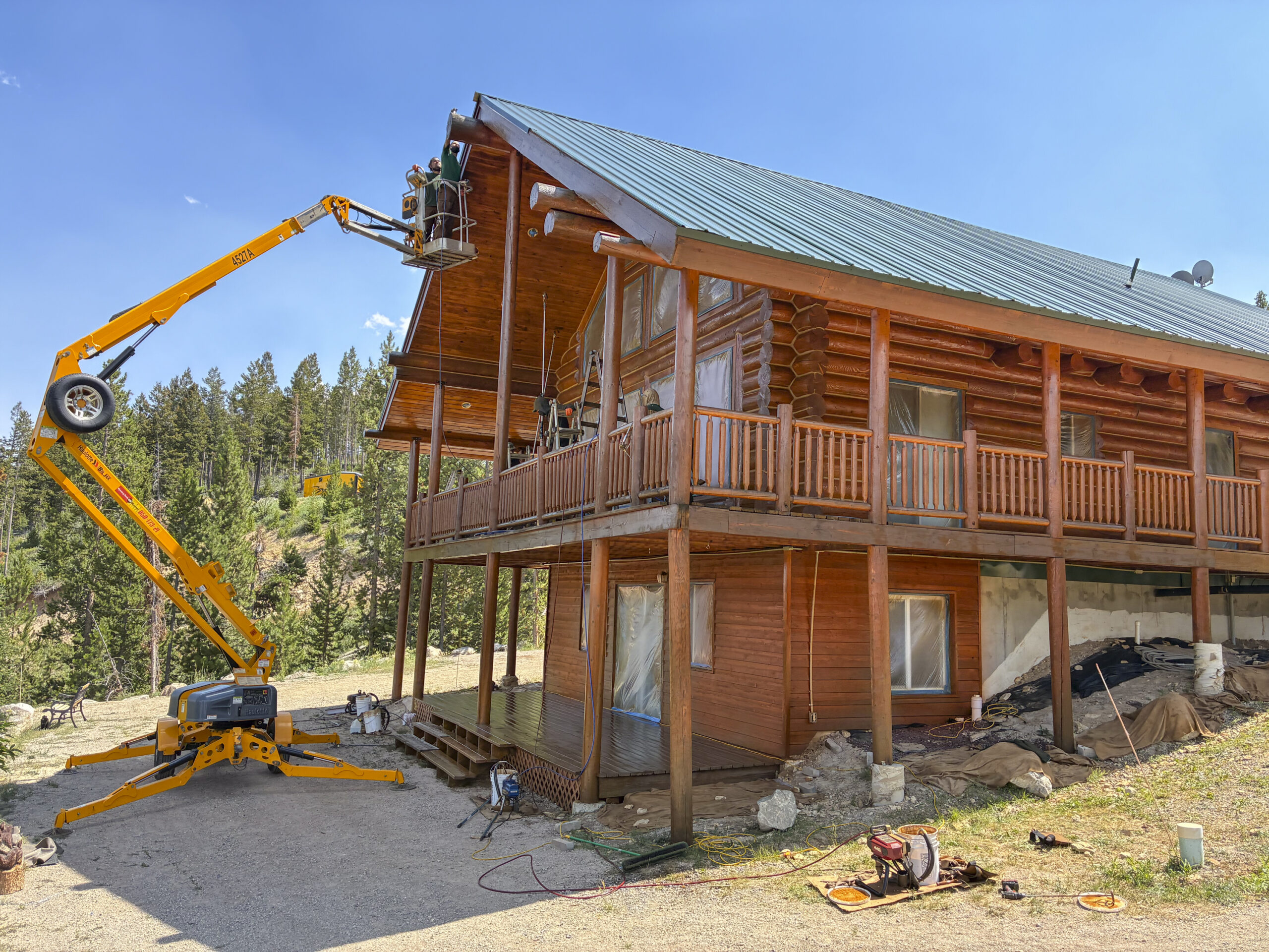 Log Cabin Restoration with Boom Lift